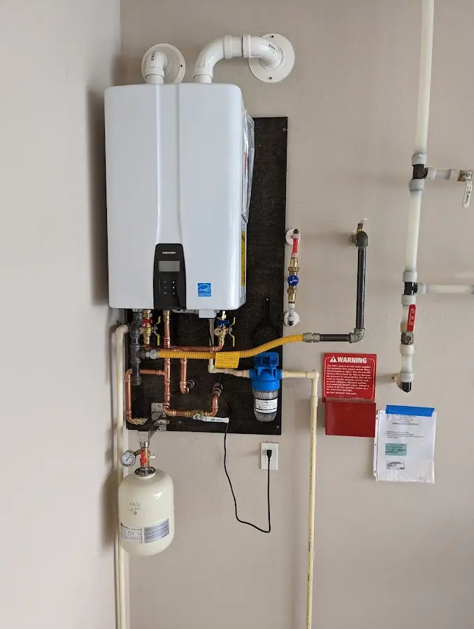 Professional plumber installing copper piping in a Austin home